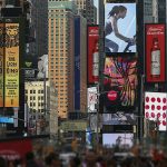 Colorful billboards and bustling crowds capture the essence of Times Square, NYC.